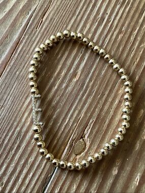 E Initial pave charm on gold beaded stretch bracelet